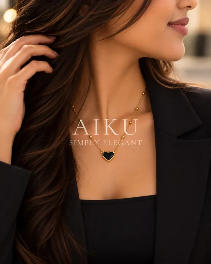Black Heart Gold Chain Necklace worn by a model